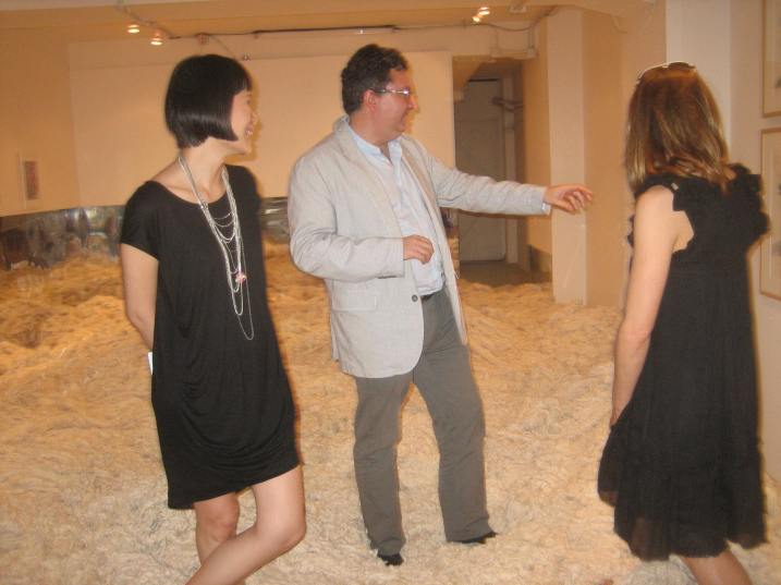 Alvaro Rodriguez Fominaya shows visitors around at Surasi Kulsowong's Golden Fortune show