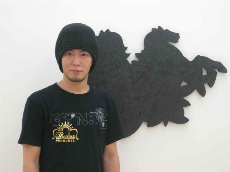 Artist Hiroshige Fukuhara next to his piece, 'The Night' at his latest solo exhibition at Ai Kowada Gallery in Japan. Image property of Art Radar Asia.